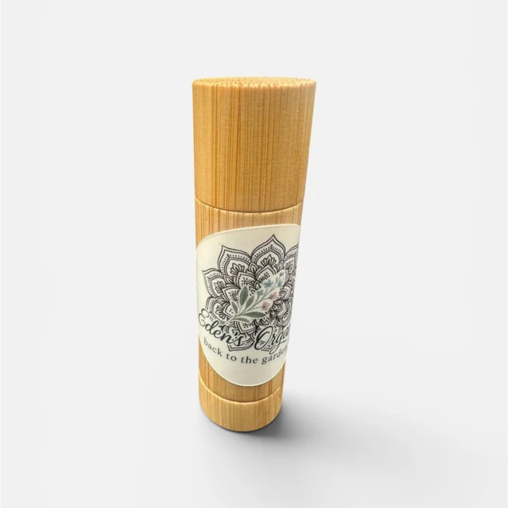 Bamboo container with a decorative label on a white background