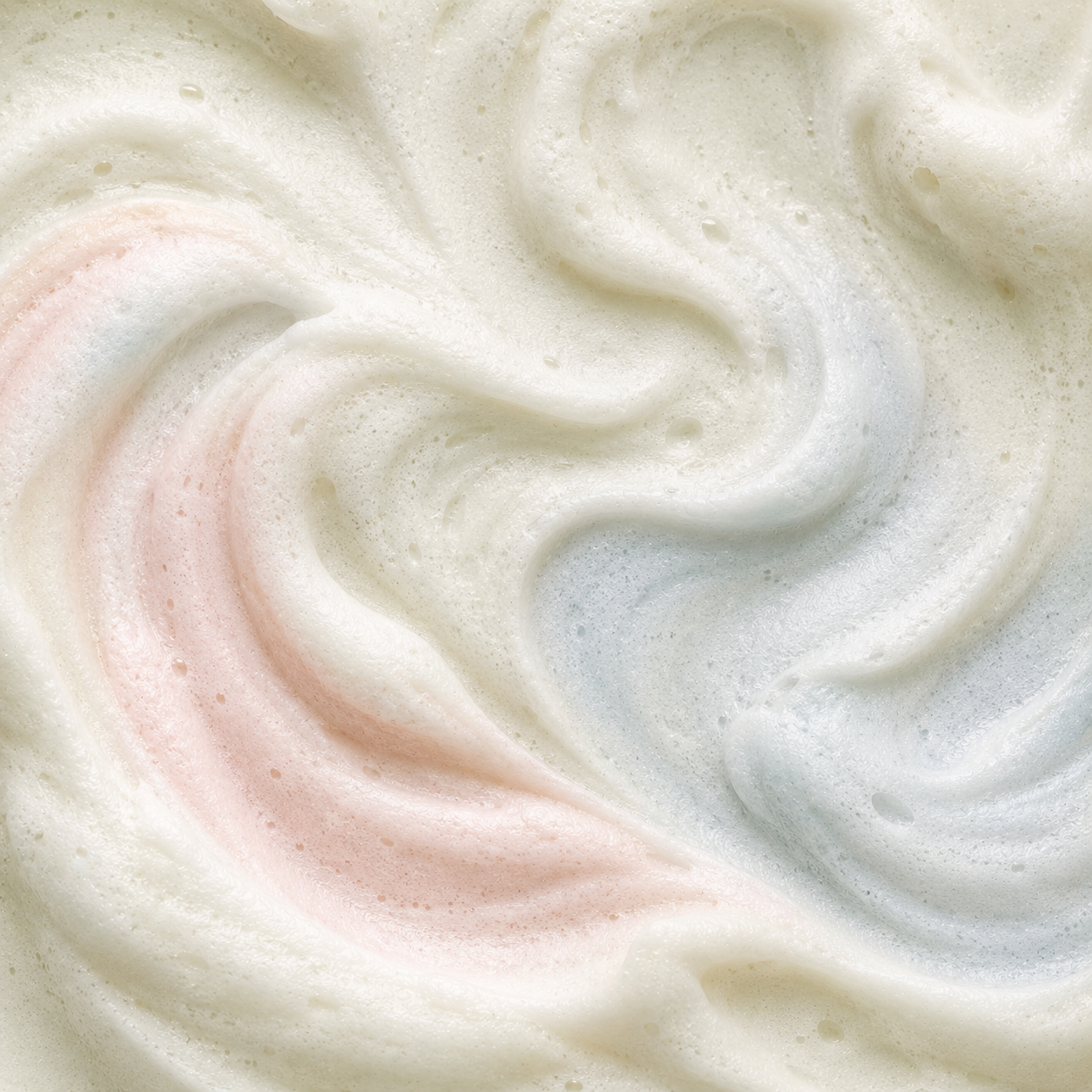 Close-up of swirled pink and white cream