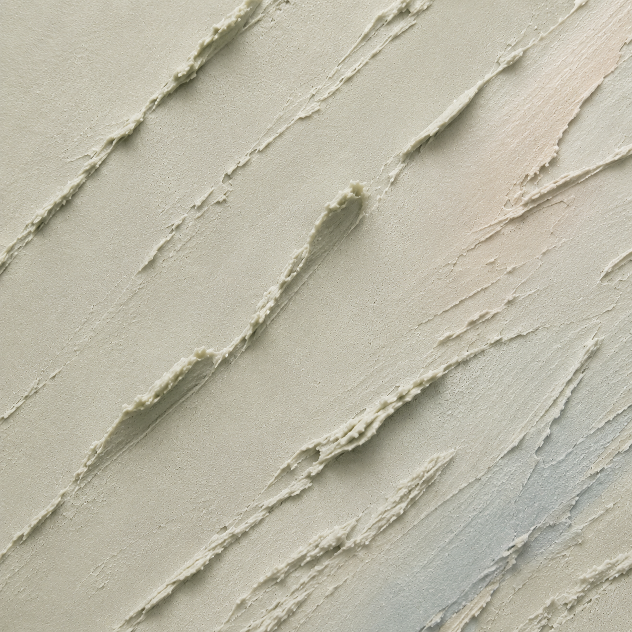 Textured wall with diagonal brush strokes in neutral tones
